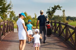 bigstock-Family-Of-Golf-Players-Walking-82259504